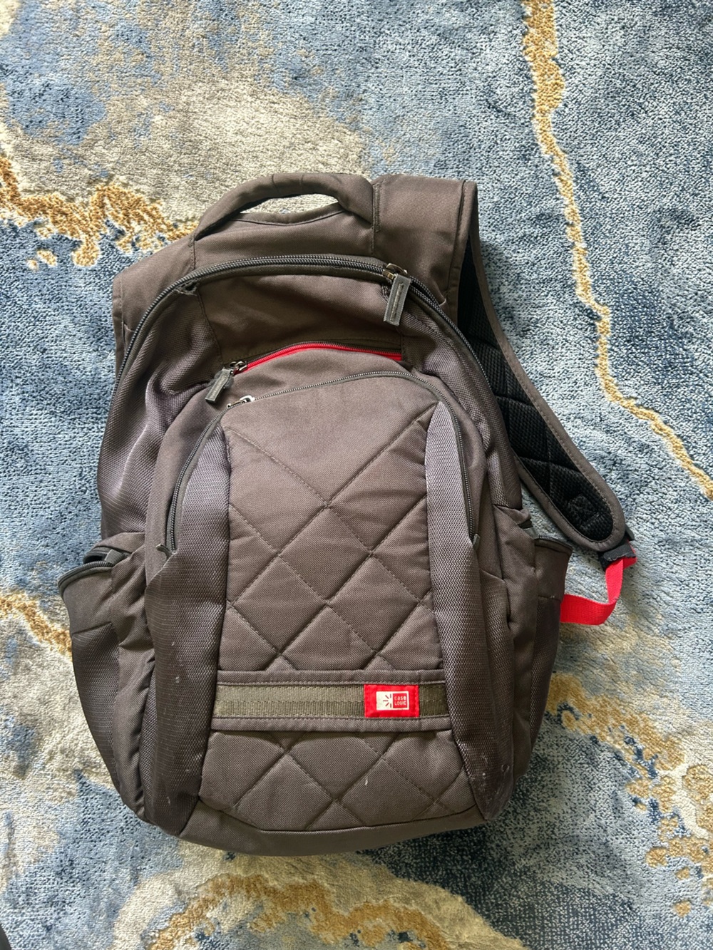 Brown Quilted Men's Backpack with Red Accents